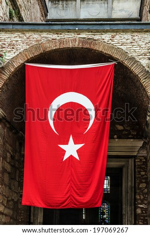 Turkish flag on the entrance to museum Hagia Sophia, Istanbul, Turkey. Hagia Sophia is the greatest monument of Byzantine Culture.