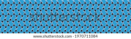 banner seamless pattern of plastic eyes on a blue background