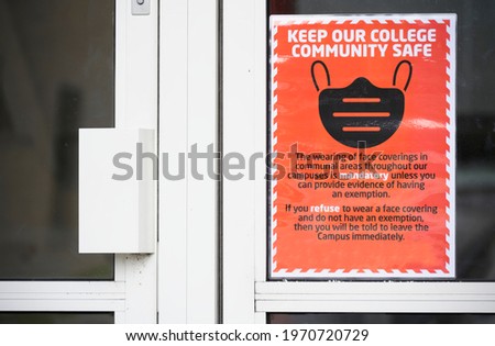 Cover your face using a mask sign at school college door