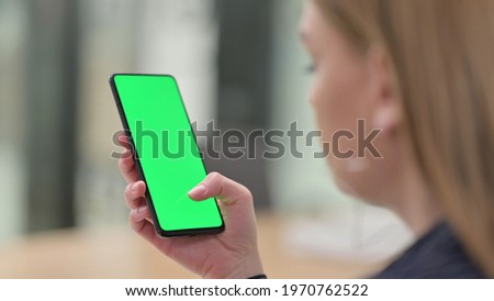 Businesswoman Using Smartphone with Green Screen