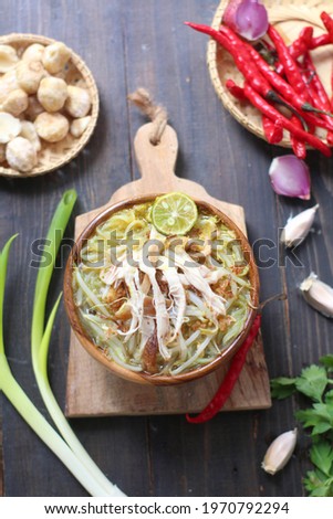 soto ayam is a traditional indonesian soup mainly composed of broth, chicken and vegetables