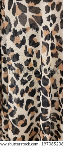 A sheer animal print cloth textile  
