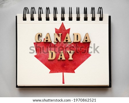 Happy Canadian Day. Drawing of the Canadian Flag. National holiday concept. Closeup, top view, texture. Congratulations for family, relatives, friends and colleagues
