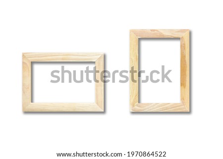 Two wooden picture frames hanging on a white wall. Blank mockup template