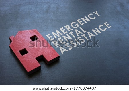 Emergency Rental Assistance Program ERAP. Red wooden home on the blackboard. Royalty-Free Stock Photo #1970874437