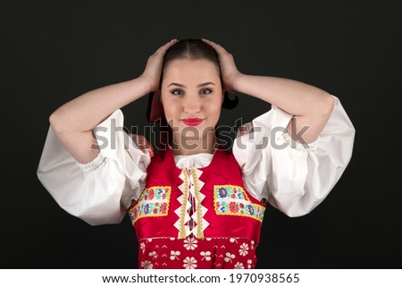 Young beautiful slovak woman in traditional dress. Slovak folklore

