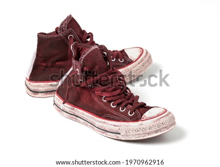 Used canvas shoes on white background