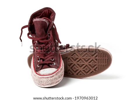 Old iconic shoes on white background