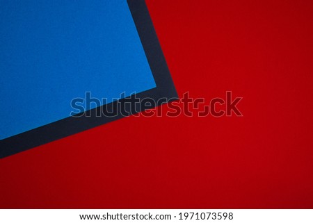 Blue, red and black abstract colored paper background