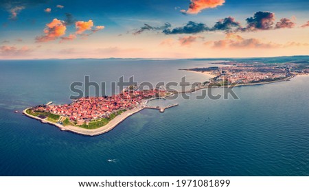 Aerial landscape photography. View from flying drone of old town of Nessebar. Stunning spring seascape of Black sea. Aerial sunrise in Bulgaria, Europe. Traveling concept background.


