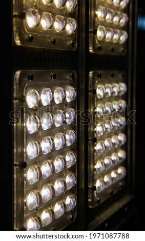 Street illumination LED light panel. Light ON. Dark background. Close up photo. 