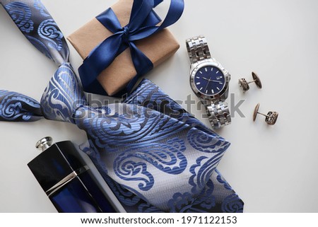 Happy father's day greeting card . set of men's accessories. men's tie, watches, cufflinks and cologne. gift concept Royalty-Free Stock Photo #1971122153
