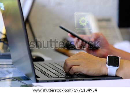 Person using on laptop computer and management digital data concept