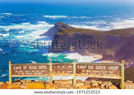 Bird's-eye view. Cape of Good Hope at the southern tip of the Cape Peninsula, South Africa. White foam of the ocean surf. Powerful ocean surf. Bright sunny summer February day. Royalty-Free Stock Photo #1971253553