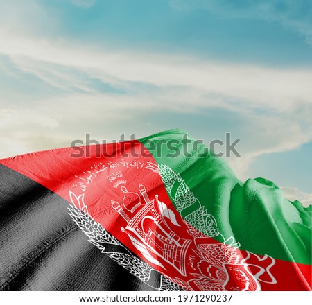 Afghanistan waving flag in the sky.