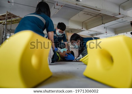 Emergency Medical First aid for head injuries of worker accident in work, Loss of feeling or loss of normal movement and Loss of function in limbs, First aid training to transfer patient. Royalty-Free Stock Photo #1971306002