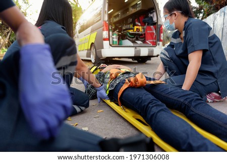 Emergency Medical First aid for head injuries of worker accident in work, Loss of feeling or loss of normal movement and Loss of function in limbs, First aid training to transfer patient. Royalty-Free Stock Photo #1971306008