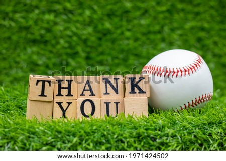 Thank you word with baseball are o green grass background