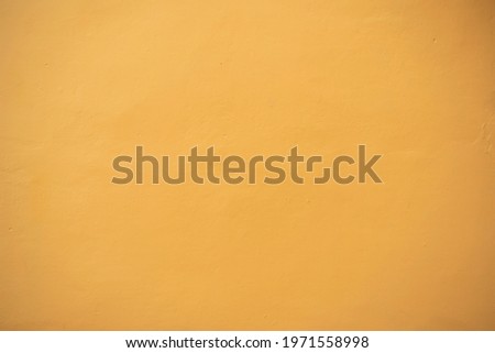 Yellow wall texture. Horizontal yellow plaster wall concrete texture background