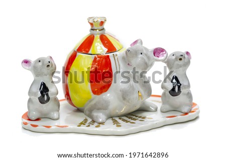 Antiques, art, collectibles. Swap meet. Isolated over white background. A set for table spices. Fabulous figurines of mice. porcelain
