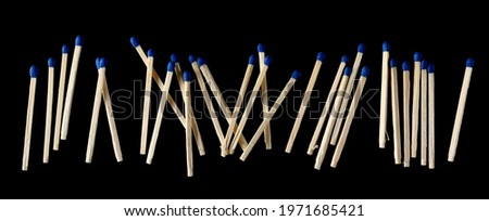 Fire matches pile, matchsticks with blue tips isolated on black background, clipping path, top view Royalty-Free Stock Photo #1971685421