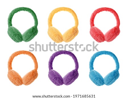 Set with different colorful soft earmuffs on white background  Royalty-Free Stock Photo #1971685631