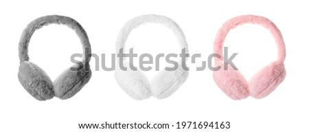 Set with different soft earmuffs on white background Royalty-Free Stock Photo #1971694163
