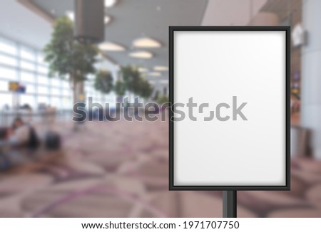 Blank advertising poster banner mockup in modern airport retail environment; large digital lightbox display screen. Billboard, poster, out-of-home OOH media display space
