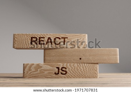 React js wooden blocks balance concept. Wooden concept Royalty-Free Stock Photo #1971707831