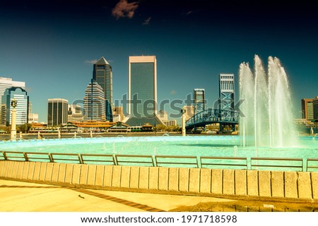Jacksonville skyline with fountain and skyscrapers on a sunny day.