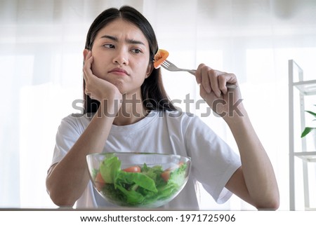 Asian woman feel anorexia, The girl does not like to eat vegetables, Healthy food. Royalty-Free Stock Photo #1971725906
