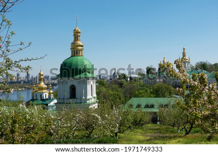 View of the lower part of the Kiev-Pechersk Lavra with the monastery garden blooming in spring