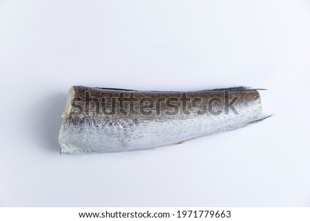 Raw hake, raw fish on a white background. View from above.
