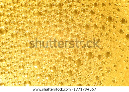 Macro photo of air bubble float on water with color golden lighting for background or wallpaper.