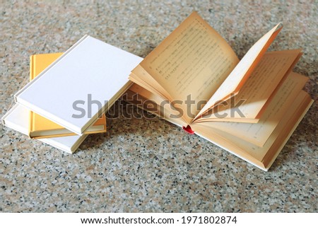 A close up of the book opened on the floor selective focus and shallow depth of field