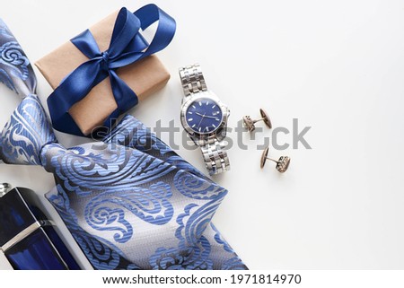 Happy father's day greeting card . set of men's accessories. men's tie, watches, cufflinks and cologne. gift concept Royalty-Free Stock Photo #1971814970