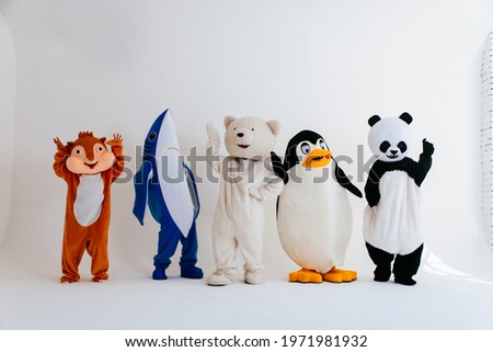 Group of mascots doing party. Concept about carnival, animals rights and lifestyle Royalty-Free Stock Photo #1971981932