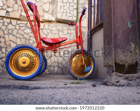 an old tricycle is without a child