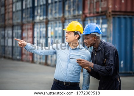 Black Worker male staff Describe the products to boss