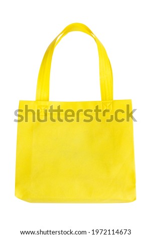 front view of yellow spunbond bag with carrying handle isolated on a white background Royalty-Free Stock Photo #1972114673