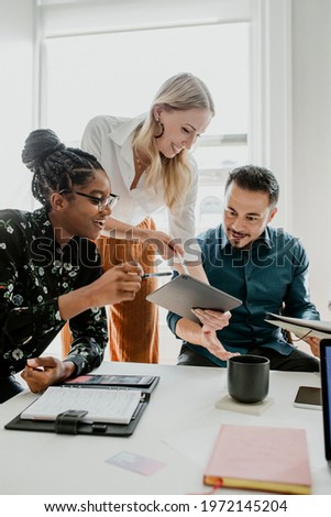 Business people working with a digital tablet in a meeting Royalty-Free Stock Photo #1972145204