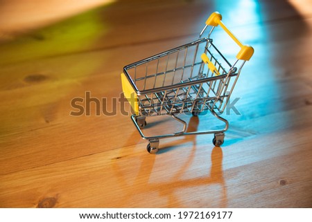 Empty Shopping basket on wooden table background