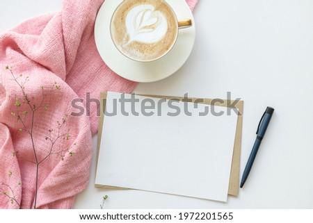 Creative flat lay photo of workspace desk. top view office desk with mock up white paper, coffee, pen, plant branches on white background. Workspace concept. Top view, copy space, mockup, flat lay.