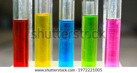 Aqueous solutions of food organic dyes in test tubes.