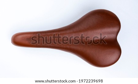 brown leather bicycle seat isolated on white background, top view Royalty-Free Stock Photo #1972239698