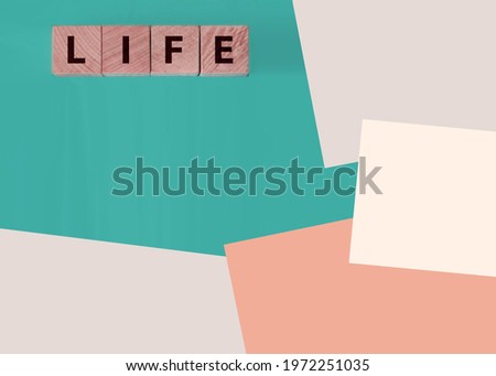 wooden cube whit the inscription Life, with on background. Safe life. Protection of life.