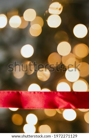 Red ribbon on a bokeh background 