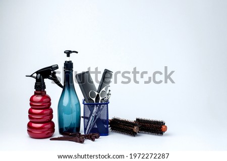 Salon equipment set, Hair cutting tools arranged isolated on white background. Various hair dresser tools isolated with copy space, such as comb, scissors, dryer. Barber and salon service concept
