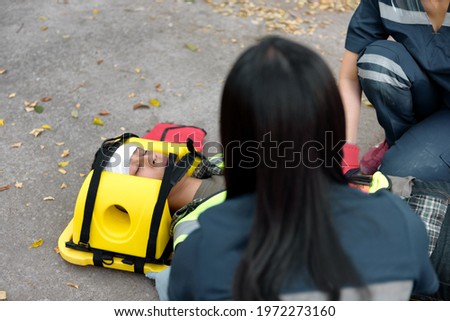 Emergency Medical First aid for head injuries of worker accident in work, Loss of feeling or loss of normal movement and Loss of function in limbs, First aid training to transfer patient. Royalty-Free Stock Photo #1972273160