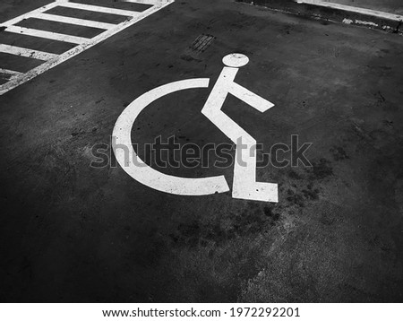 close up wheelchair paint on floor, medical and healthcare, life insurance business technology, national disability day concept, black and white tone